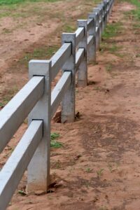 The concrete fence in the sand